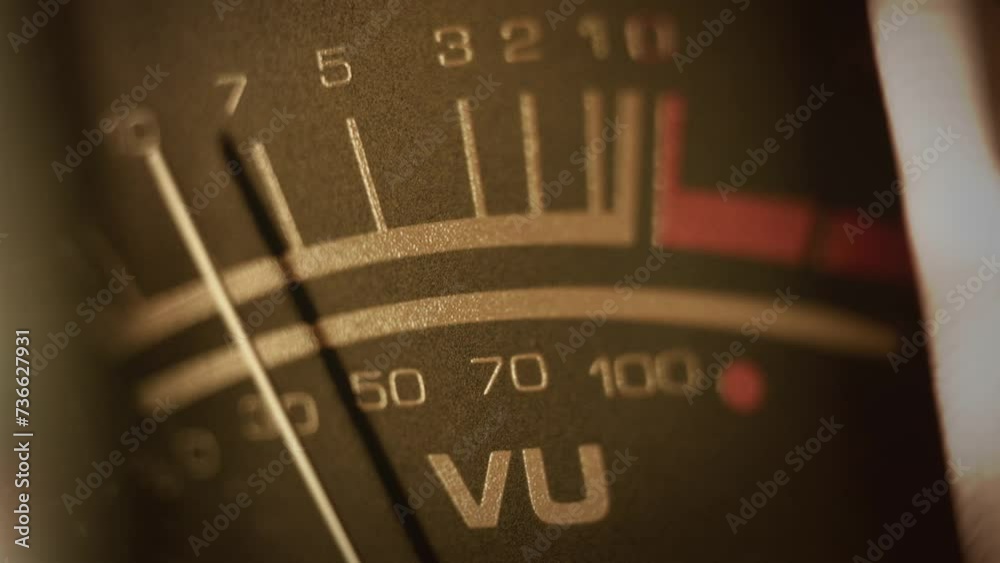 Macro shot of a studio VU, volume meter. Symbol of music production, recording and live show broadcasting. A pro equipment video loop, with a natural color aesthetic. Ideal also for intros or logos