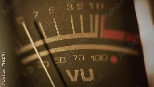 Macro shot of a studio VU, volume meter. Symbol of music production, recording and live show broadcasting. A pro equipment video loop, with a natural color aesthetic. Ideal also for intros or logos photo