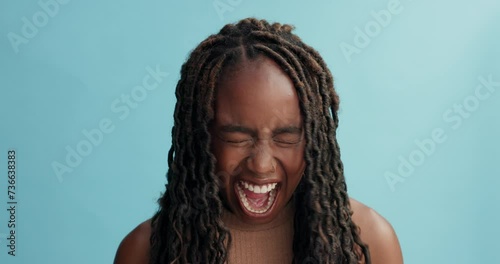 Stress, angry or black woman screaming in studio for disaster, mistake or mental health crisis on blue background. Depression, anxiety or female model frustrated, panic or overwhelmed by overthinking photo