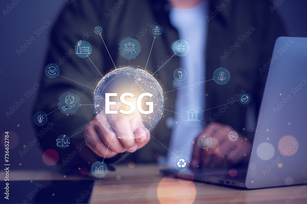 ESG sustainable investment concept, investor touching environmental social governance( ESG) icon on virtual hologram, sustainability, investing.sustainability, investing. ESG sustainable investment concept, investor touching environmental social governance( ESG) icon on virtual hologram, sustainability, investing.sustainability, investing.