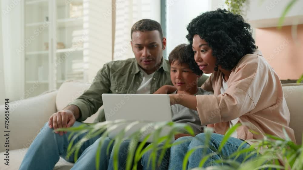Home interior multiracial family parents child using laptop device together African American mother father and Caucasian little kid boy son winnning prize online lottery victory rejoice in apartment Home interior multiracial family parents child using laptop device together African American mother father and Caucasian little kid boy son winnning prize online lottery victory rejoice in apartment