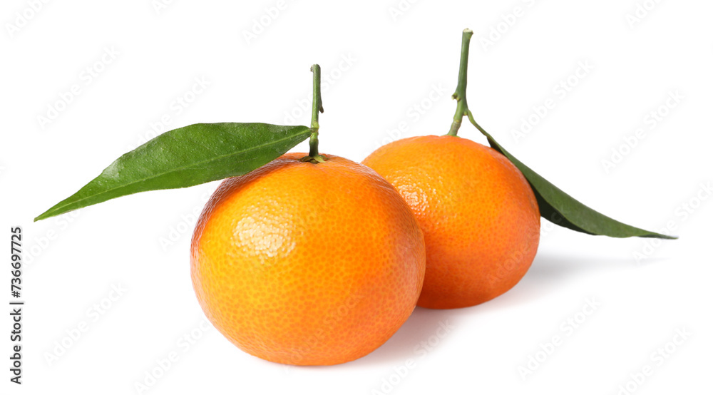 Fresh ripe juicy tangerines with green leaves isolated on white Fresh ripe juicy tangerines with green leaves isolated on white