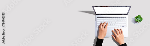 Person using a laptop computer from above