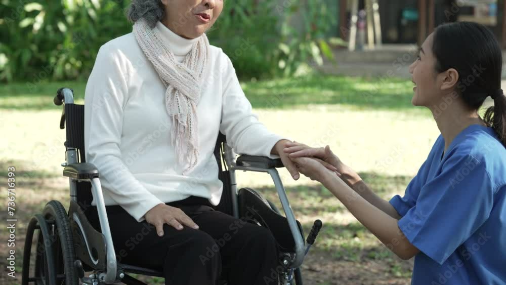 Compassionate Asian woman provides care to elderly person in wheelchair outdoors. Engaging in physical therapy, happiness, encouraging positive environment for mature individuals with grey hair. Compassionate Asian woman provides care to elderly person in wheelchair outdoors. Engaging in physical therapy, happiness, encouraging positive environment for mature individuals with grey hair.