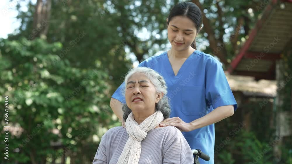 Compassionate Asian woman provides care to elderly person in wheelchair outdoors. Engaging in physical therapy, happiness, encouraging positive environment for mature individuals with grey hair. Compassionate Asian woman provides care to elderly person in wheelchair outdoors. Engaging in physical therapy, happiness, encouraging positive environment for mature individuals with grey hair.