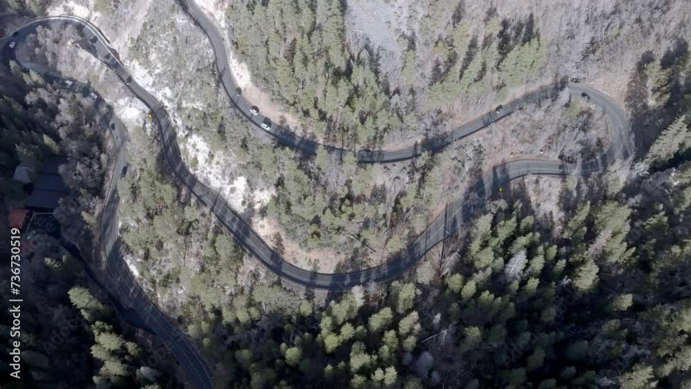 Switchback road with cars driving on Highway 89 A in Sedona, Arizona with drone video overhead stable. Switchback road with cars driving on Highway 89 A in Sedona, Arizona with drone video overhead stable.
