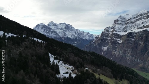 Fronalpstock Glarus Switzerland aerial over the forest towards winter beauty photo