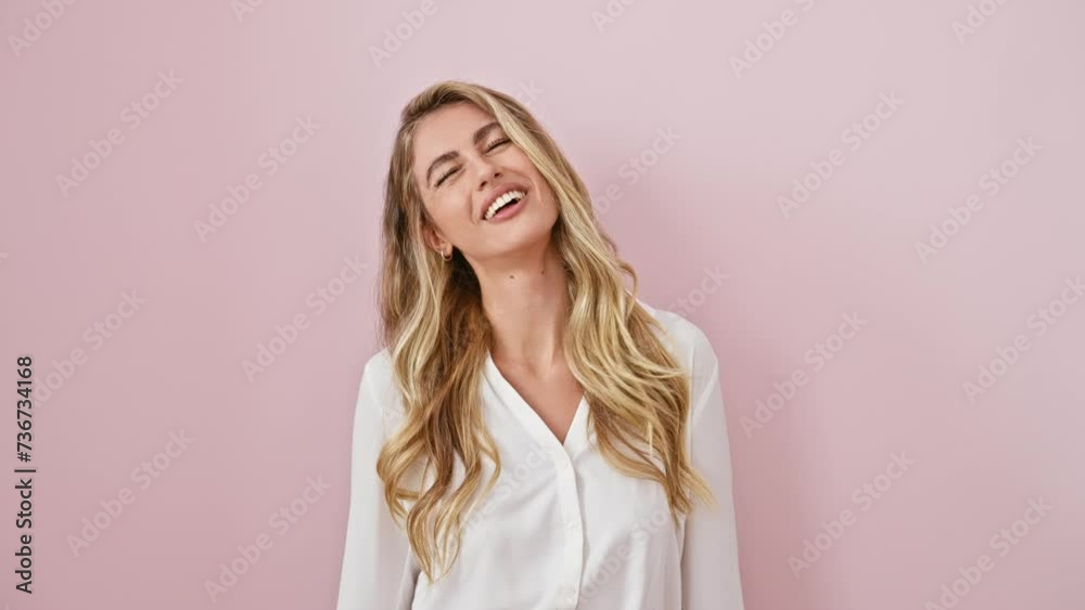 Crazy fun with a young blonde woman making a comical fish face expression - a hilarious gesture, standing confidently over a pink isolated background, wearing a shirt. Crazy fun with a young blonde woman making a comical fish face expression - a hilarious gesture, standing confidently over a pink isolated background, wearing a shirt.