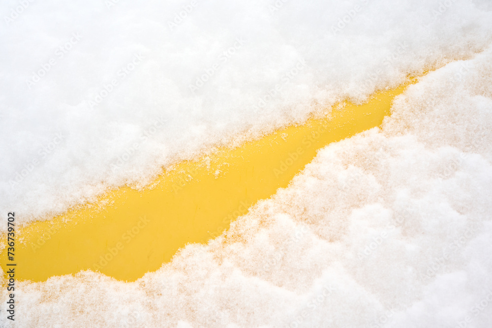 Yellow pipe covered under dense snow Yellow pipe covered under dense snow