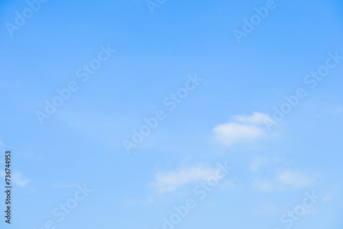 beautiful blue sky and white fluffy group of clouds with sunrise in the morning, natural background