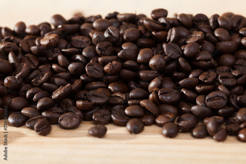 Fototapeta premium Image of fresh coffee beans on natural wooden background, nobody