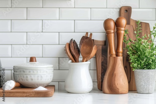 A well-organized, stylish kitchen setup featuring modern cooking utensils on a clean backdrop photo