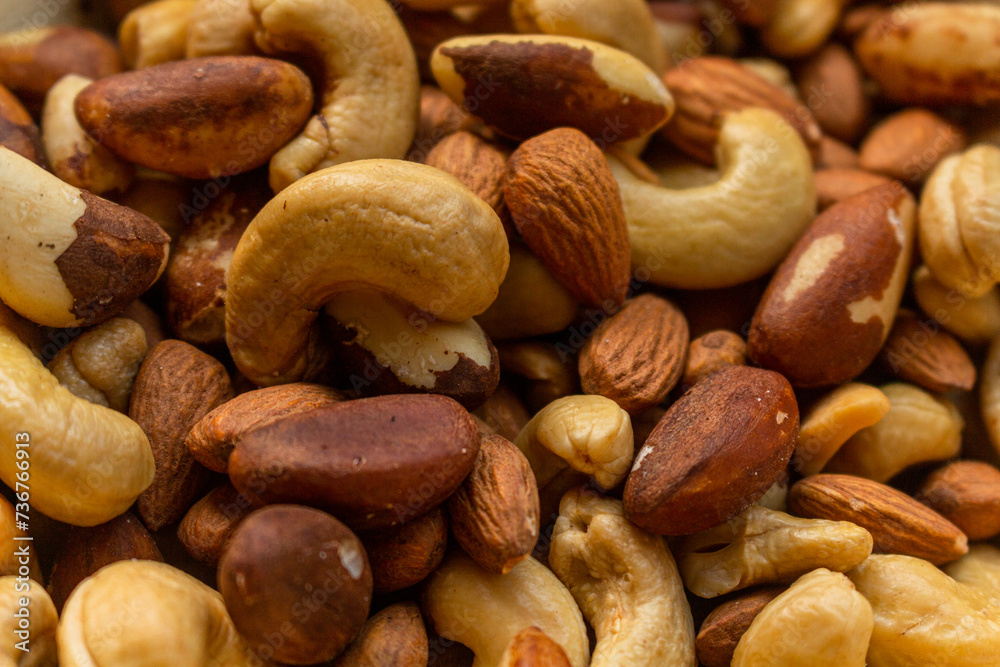 Heap of Brazil nuts, cashews and almonds in a bowl Heap of Brazil nuts, cashews and almonds in a bowl