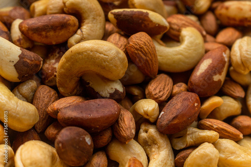 Heap of Brazil nuts, cashews and almonds in a bowl
