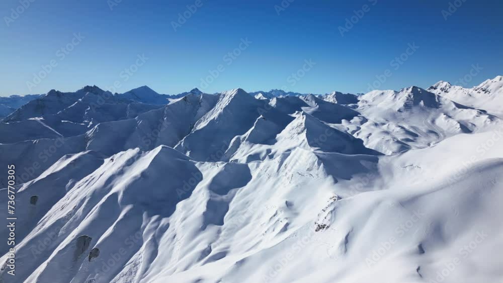 beautiful panoramic view over snow-covered mountains. pan over blue sky and wide horizon beautiful panoramic view over snow-covered mountains. pan over blue sky and wide horizon