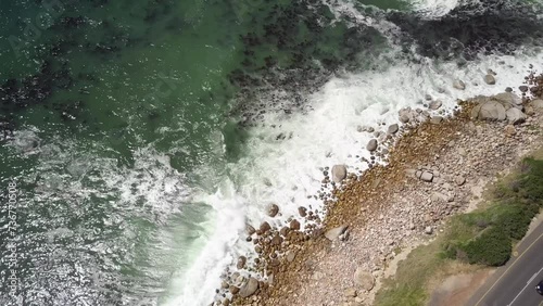 Foamy Waves Splashing Rocky Coast Down The Road At Twelve Apostles Mountains In Cape Town, South Africa. Aerial Shot