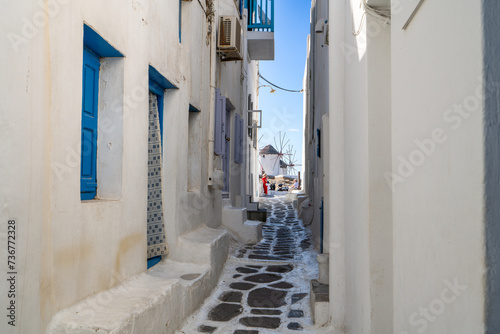 Empty narrow street of Mykonos town overlooking the Windmills. Mykonos Island in Greece