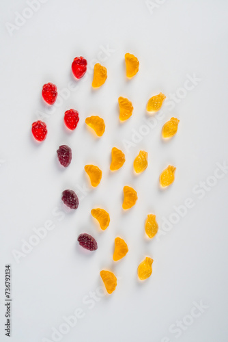 Fruit gummi candies assortment on white background 