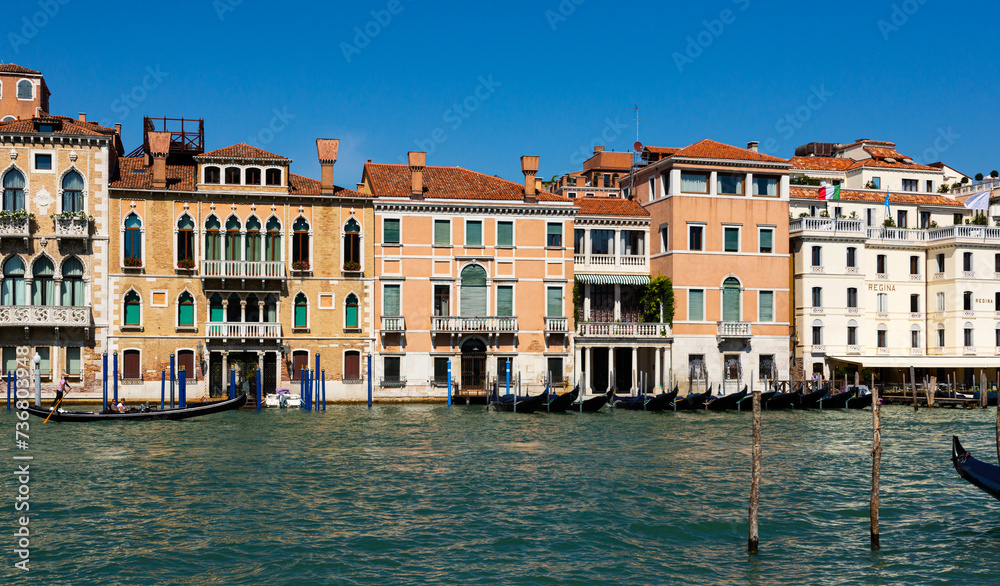 Cityscape image of main Venetian canal Grand Canal with old architecture and gondolas
