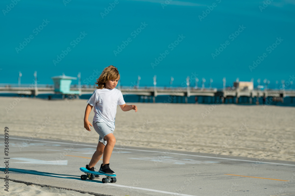 Kid with skateboard. Child hold skate board. Healthy sport and activity for school kids in summer. Sports fun. Kid with skateboard. Child hold skate board. Healthy sport and activity for school kids in summer. Sports fun.