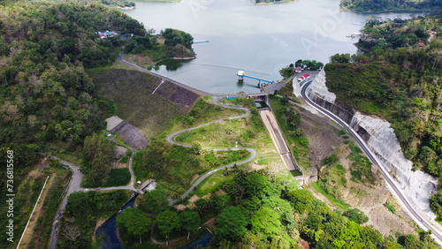 Sermo Reservoir is a water tourist attraction in Yogyakarta which is in the middle of the countryside with green trees around it. Top view photo