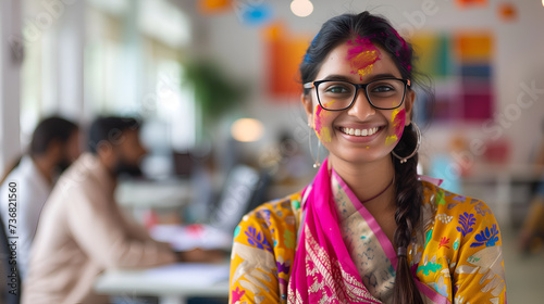 Portrait of an Indian female corporate employee, holi celebration photo