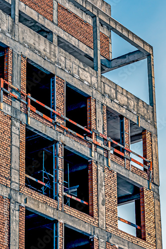 A fragment of the wall of a building under construction on a winter day