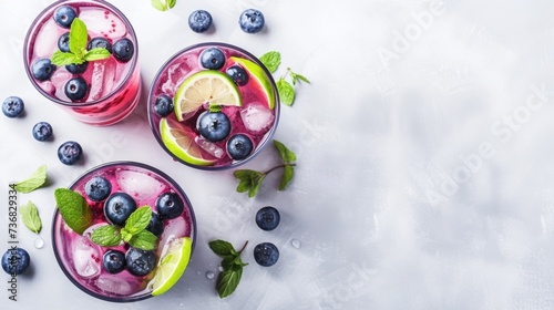 Refreshing berry cocktail with mint, lime, and ice, perfect for summer and culinary themes.