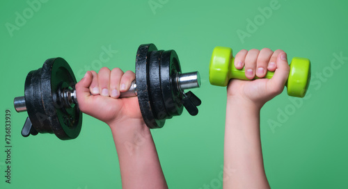 Male and female hands with dumbbells close-up. Training muscles. Female and male hand holds dumbbell. Muscular hands, exercises with dumbbells. Strong muscles. Dumbbell. Fitness and Sport.