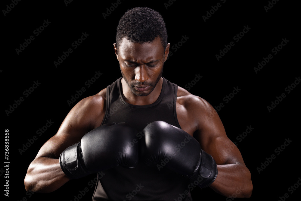 Focused African American boxer prepares for a match, with copy space