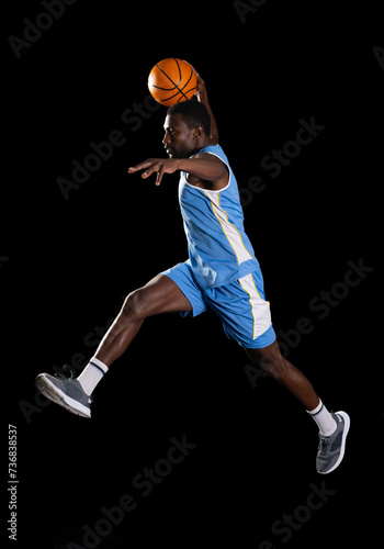 African American man in mid-air basketball action