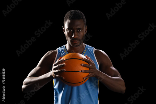 African American man holds a basketball, with copy space © wavebreak3