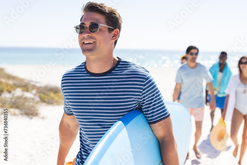Young Caucasian man enjoys a sunny beach day