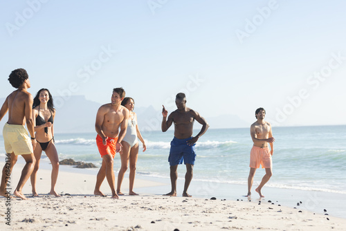 Diverse group of friends enjoy a day at the beach