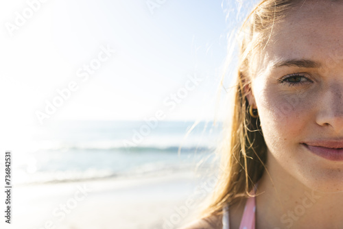 Close-up of a young Caucasian woman at the beach, with copy space