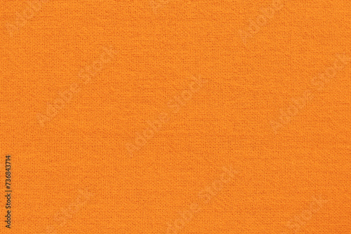 Orange fabric cloth texture for background, natural textile pattern. photo