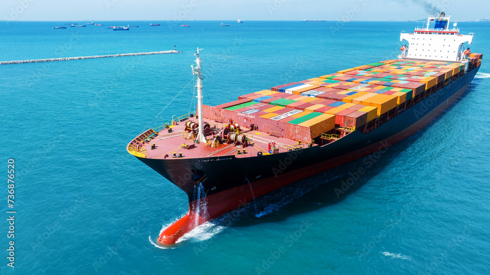Naklejka premium front view Cargo Container ship with contrail in the ocean ship carrying container and running for import export concept technology freight shipping by ship
