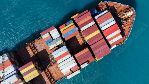 top view Cargo Container ship in the ocean ship carrying container and running for import export concept technology freight shipping by ship © Yellow Boat