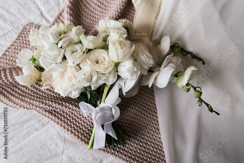 Wedding bouquet of the bride from white flowers - orchids. Bride and groom. Wedding, engagement. Bride and groom. Wedding bouquet of the bride.