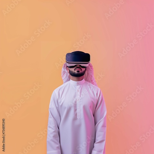 Middle Eastern Arab Young Adult Man Wearing VR Headset, Enjoying Virtual Reality Experience on Gradient Peach Background with Studio Lighting. Square Photo Portrait with Empty Copy Space