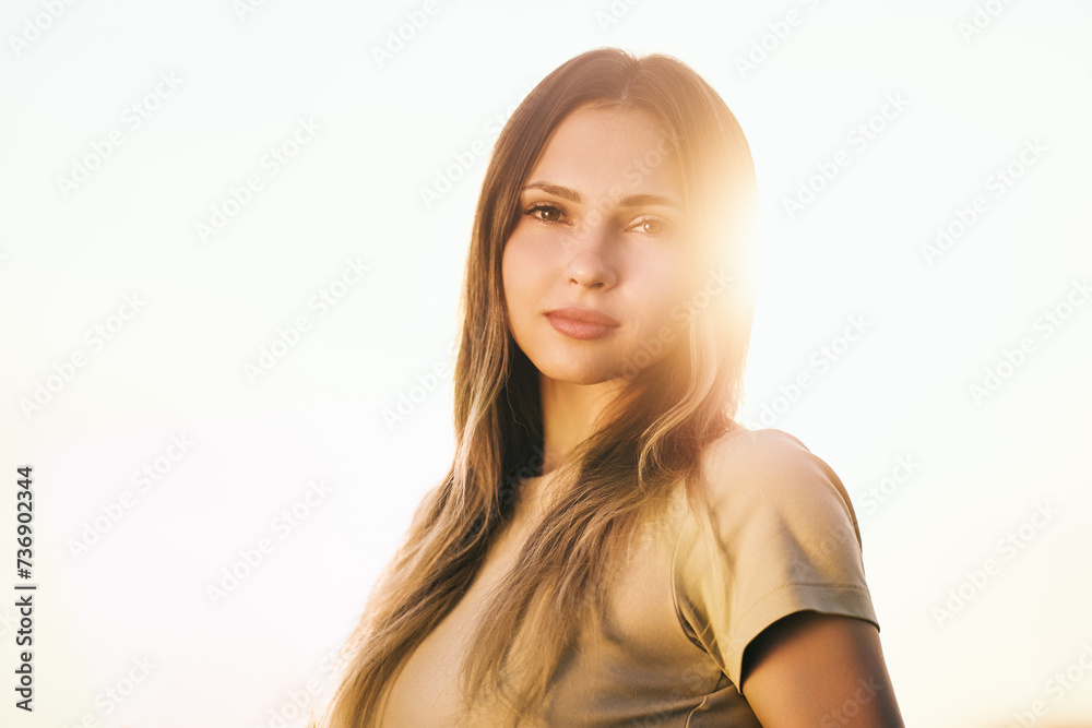 Portrait photograph of young Caucasian woman in backlight. Portrait photograph of young Caucasian woman in backlight.