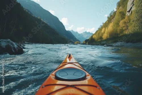 whitewater kayaking, down a white water rapid river in the mountains