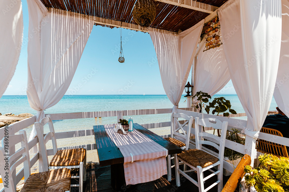 Paradise restaurant on tropical seashore. Zakhyntos, Greece.