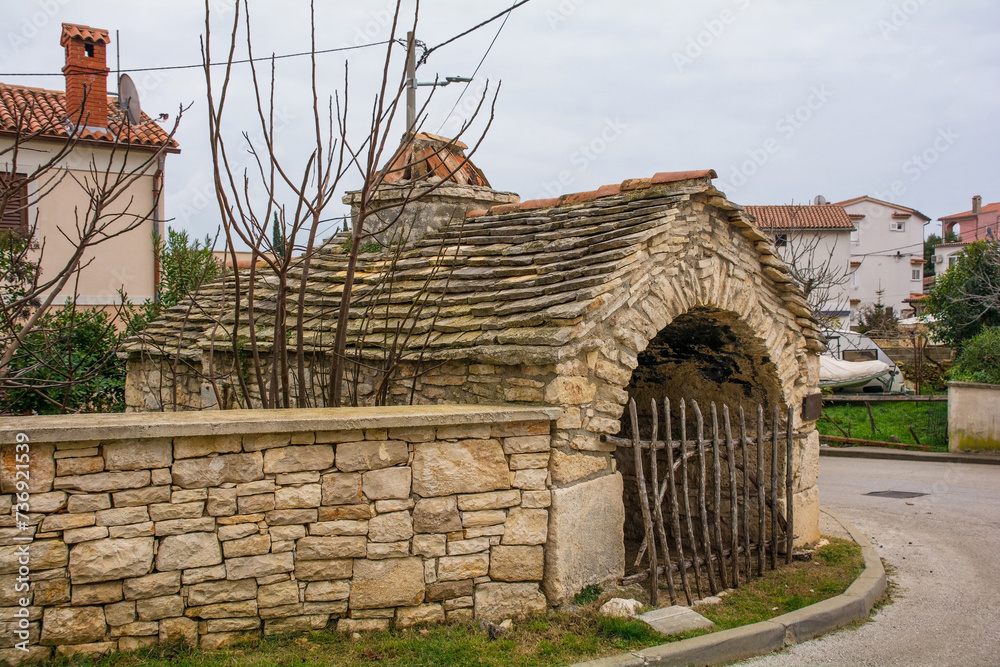 An 18th century Istrian stone bread oven in Premantura in Istria, Croatia. There were many in the past, but this is the only one remaining in town today
