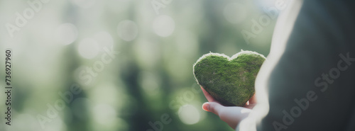 People holding green heart, save planet, earth day, sustainable living, ecology environment, climate emergency action, world environment day concept, illustration for global warming content photo