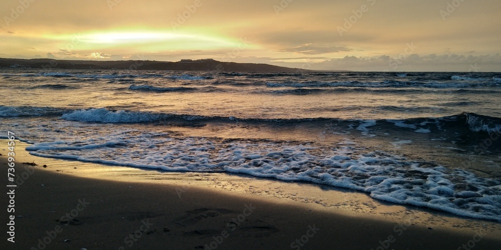 SUNSET AT THE BEACH