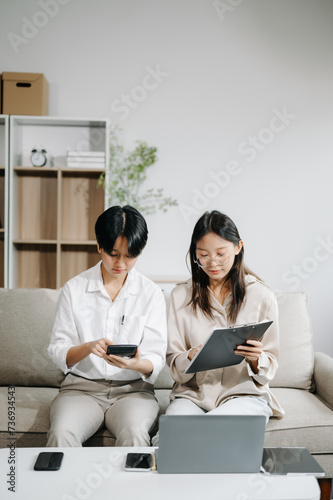 Portrait of success business people working together in office. Couple teamwork startup concept on sofa