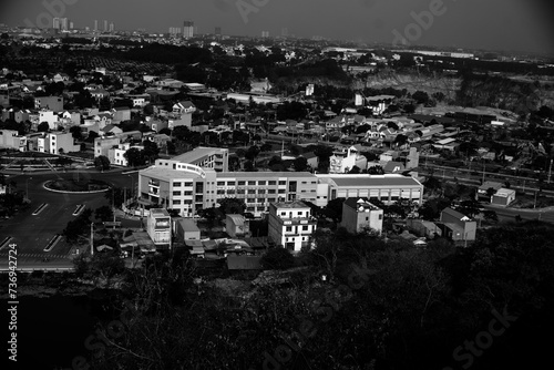 black and white Full frame shot of building, View of cityscape against sky during sunset,Vehicles on road in city against sky. Buildings in city against cloudy sky