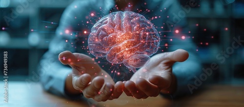 man hand working with creative human brain microcircuit hologram photo