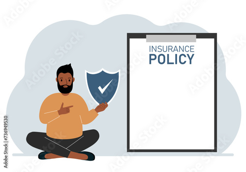 A man holds an insurance policy sign in his hands. The concept of life insurance, property or natural disasters.